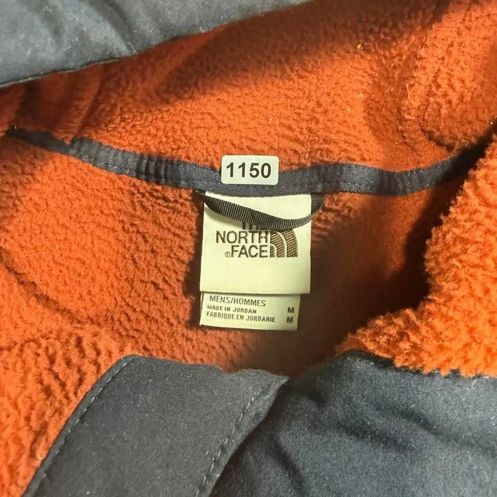 The North Face orange fleece hoodie with navy blue trim, size M